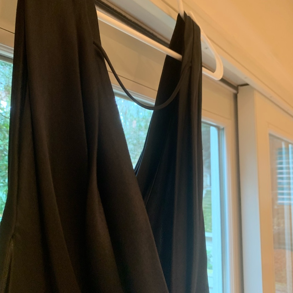 Black silk cocktail dress with draped back. Perfect for holiday parties.